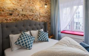 Posteľ alebo postele v izbe v ubytovaní Central Apartments Piwna