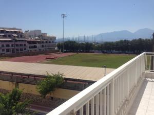 a view of a field from the balcony of a building at Stunning Seaview Town Apartment in Agios Nikolaos