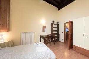 Posteľ alebo postele v izbe v ubytovaní Sdrucciolo dei Pitti Second floor