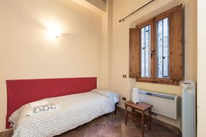 Posteľ alebo postele v izbe v ubytovaní Sdrucciolo dei Pitti Second floor + 6 fotografií