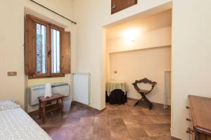 Posteľ alebo postele v izbe v ubytovaní Sdrucciolo dei Pitti Second floor