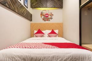 Llit o llits en una habitació de SUPER OYO 456 Aljadid Guest House Syariah