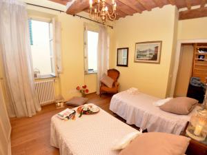 Ένα ή περισσότερα κρεβάτια σε δωμάτιο στο Lucca Retreat with Pool