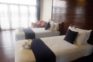 Postel nebo postele na pokoji v ubytování Sengahloune Resort