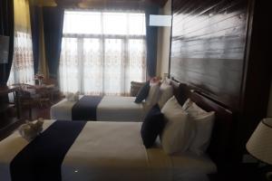 Postel nebo postele na pokoji v ubytování Sengahloune Resort