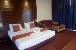 Postel nebo postele na pokoji v ubytování Sengahloune Resort
