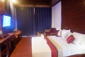 Postel nebo postele na pokoji v ubytování Sengahloune Resort