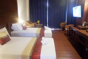 Postel nebo postele na pokoji v ubytování Sengahloune Resort