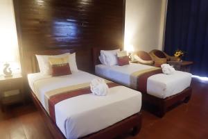 Postel nebo postele na pokoji v ubytování Sengahloune Resort