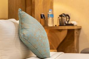 Postel nebo postele na pokoji v ubytování Hotel ARJUNAA