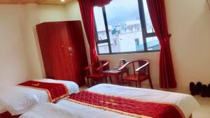 Postel nebo postele na pokoji v ubytování May Hong Hotel
