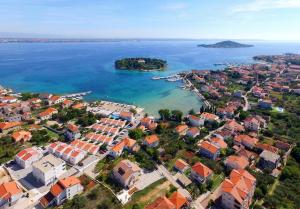 an aerial view of a city and the ocean at Apartments Sunrise in Preko