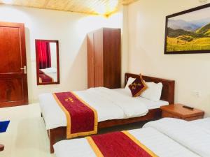 Postel nebo postele na pokoji v ubytování May Hong Hotel