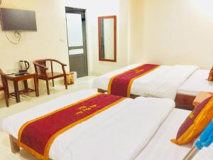 Postel nebo postele na pokoji v ubytování May Hong Hotel