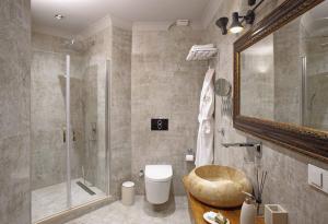 a bathroom with a shower and a toilet and a sink at Manici Kasri in Kucukkuyu +43 photos