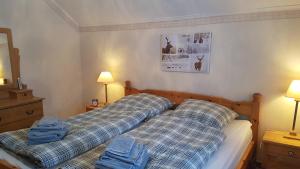 En eller flere senge i et værelse på Villa Mia