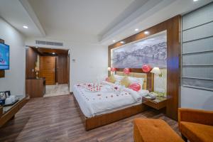 Postel nebo postele na pokoji v ubytování Regenta Central Srinagar, Rajbagh