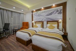 Postel nebo postele na pokoji v ubytování Regenta Central Srinagar, Rajbagh