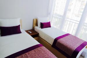 A bed or beds in a room at Modern Suites