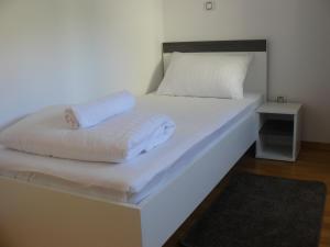 A bed or beds in a room at Our Nest Accommodation
