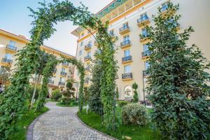 an archway in front of a building at LOTTE City Hotels Tashkent Palace in Tashkent