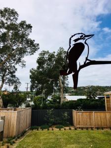 a statue of a bird perched on a branch at Pacific Terraces 2, 38 Pacific Street in Crescent Head