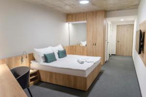 Postel nebo postele na pokoji v ubytování Hotel D1