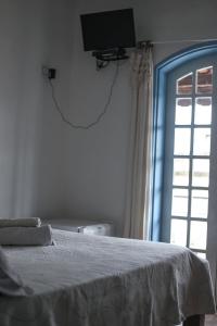 Cama o camas de una habitación en Pousada e Chalés Itamoara