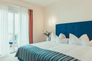 Posteľ alebo postele v izbe v ubytovaní Hotel Tobler