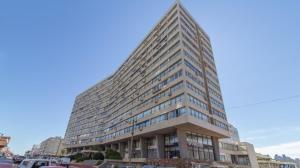 a large office building with a tall building at SANTOS DUMONT in Punta del Este