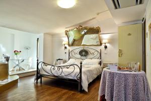 Postel nebo postele na pokoji v ubytování Hotel Al Castello + 37 fotografií