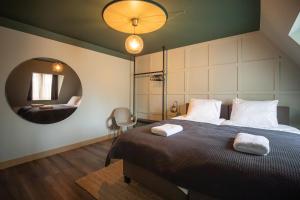 Postel nebo postele na pokoji v ubytování Seabreeze Suites - near Zandvoort aan Zee + 24 fotografií