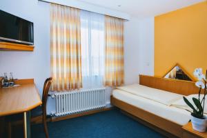 Postel nebo postele na pokoji v ubytování Hotel Central