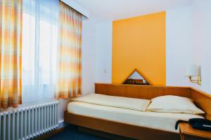 Postel nebo postele na pokoji v ubytování Hotel Central