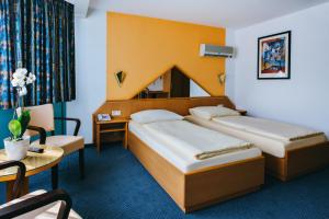 Postel nebo postele na pokoji v ubytování Hotel Central