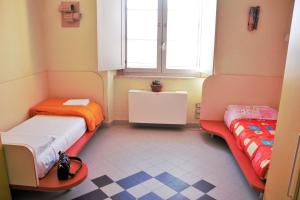 Postel nebo postele na pokoji v ubytování Ostello La Miniera