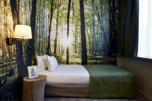 Postel nebo postele na pokoji v ubytování Hotel Zuid