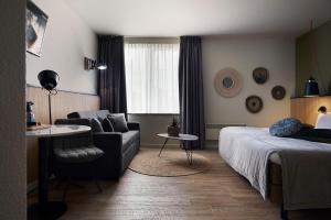 Postel nebo postele na pokoji v ubytování Hotel Zuid