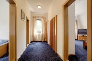 Una cama o camas en una habitación de Hotel Laguna Slapy