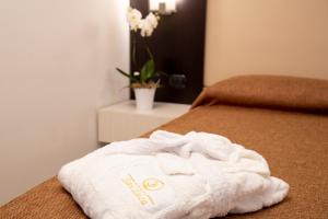 Postel nebo postele na pokoji v ubytování Hotel San Luca
