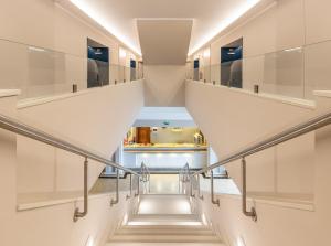 a staircase in a building with white walls and ceilings at Hotel Marina Rio in Lagos