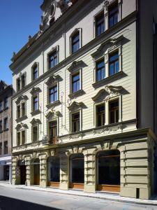 a large building with a large window on the side of it at INNSiDE by Meliá Prague Old Town in Prague