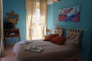 Ένα ή περισσότερα κρεβάτια σε δωμάτιο στο B&B occhi di mare