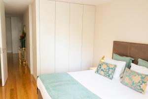 Cama ou camas em um quarto em Graça Apartment