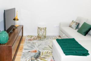 Cama ou camas em um quarto em Graça Apartment