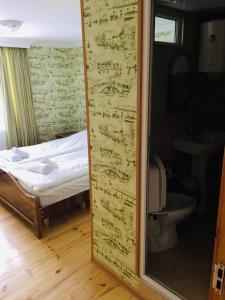 Postel nebo postele na pokoji v ubytování Guesthouse Qarim