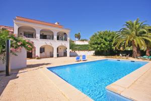 a swimming pool in front of a villa at Villa Roel in Calpe