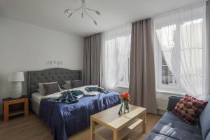 Posteľ alebo postele v izbe v ubytovaní Central Apartments Piwna