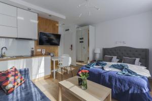 Posteľ alebo postele v izbe v ubytovaní Central Apartments Piwna
