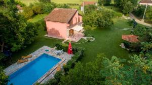 an aerial view of a house and a swimming pool at Vila Andrea in Danilovgrad